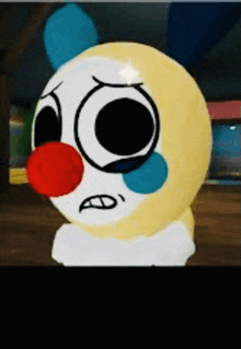 a clown with a red nose and tears on his face