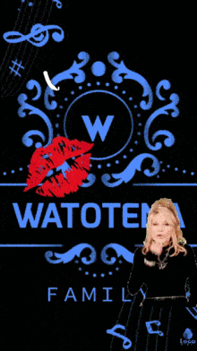 a woman blowing a kiss on a welcome sign