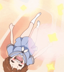 a girl in a school uniform is laying on her back with her arms outstretched