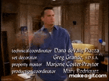 a man in a blue shirt is standing in a living room with the name dana devally piazza on the bottom