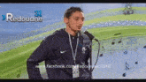 a man singing into a microphone with the number 31 on the bottom right