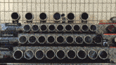 a display of advanced gauges and clocks on a metal shelf