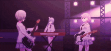 three anime girls are playing guitars and a keyboard on stage .