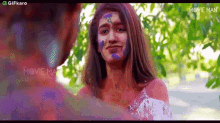 Rubbing Paint On Your Face Gifkaro GIF - Rubbing Paint On Your Face Gifkaro Playing With Paint GIFs