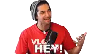 a man is wearing a red shirt that says vlc hey