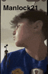 a man in a blue shirt has a siren head on his shoulder .