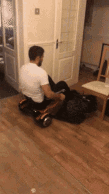 a man in a white shirt is riding a hoverboard