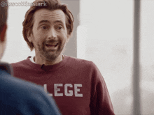 a man wearing a sweatshirt that says lege