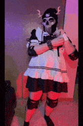 a person dressed in a maid outfit with a skull mask on their face