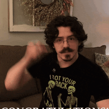 a man wearing a black t-shirt that says i got your back