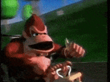 donkey kong is playing a video game while holding a controller .