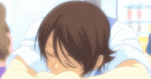 a person laying down with their head on their arms
