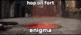 a manhole cover with the words hop on fort enigma written above it