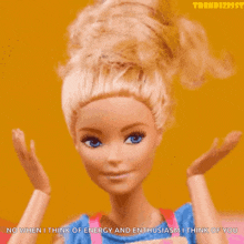 a barbie doll says " no when i think of energy and enthusiasm i think of you " on a yellow background
