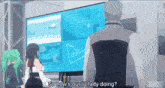 a man and a woman are standing in front of a large screen with the words so how 's our lil lady doing