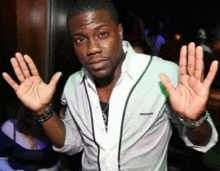 a man wearing a white shirt with the word lacoste on the front