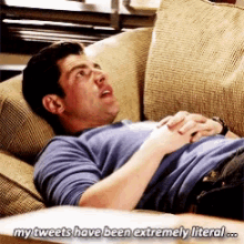 a man is laying on a couch with a caption that says my tweets have been extremely literal