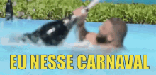 a man is laying in a pool holding a bottle of wine and the words eu nesse carnaval are above him