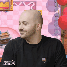 a man wearing a black clash royale shirt