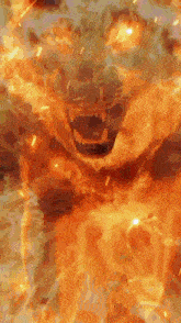 a close up of a person surrounded by flames with their mouth open