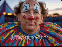 a man dressed as a clown with the hashtag textorout