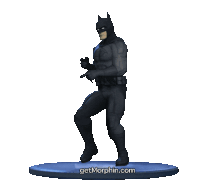 a statue of batman is dancing on a blue base