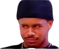 a man wearing a black hat and a black shirt is making a face .