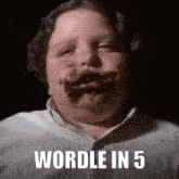 a young boy with chocolate on his face is making a funny face .