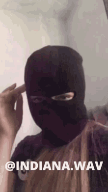 a person wearing a ski mask with the words @ indiana.wav below them