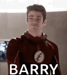 a close up of a man in a flash suit with the word barry written on it .