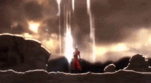 a man in a red suit is standing in front of a waterfall with a sword .