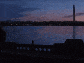 a sunset over a body of water with the words " on your left " below it