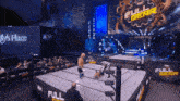 a wrestling ring with a full gear sign on it