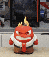 an angry cartoon character with flames on his head