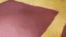 a person 's shadow is cast on a pink surface