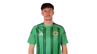 a man wearing a green shirt with the word ireland on it