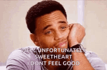 a man is sitting on a couch with his head resting on his hand and says well unfortunately sweetheart i dont feel good