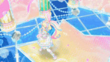 a girl in a pink and white dress is dancing on a blue floor