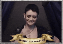 a picture of a girl with a banner that says gauntlet master on it