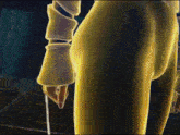 a man is holding a large sword in his hand .