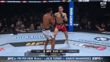 two men are fighting in a boxing ring with a bud light banner