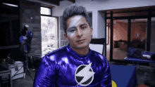 a man in a purple superhero costume with a white lightning bolt on his chest
