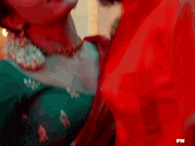 a close up of a woman 's neck with the letters pn on the bottom right