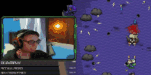 a man wearing headphones is playing a video game on a screen that says delentaplay