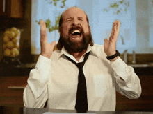 a man with a beard wearing a white shirt and tie is screaming with his mouth open