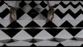a black and white checkered floor with a person 's feet on it