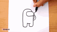 a person is drawing an among us character with a marker