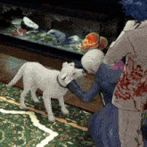 a man and woman petting a small white dog