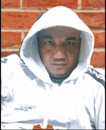 a man is wearing a white hoodie with the word amg on it