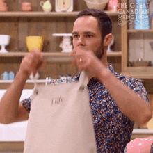 Wearing An Apron Loïc GIF - Wearing An Apron Loïc The Great Canadian Baking Show GIFs